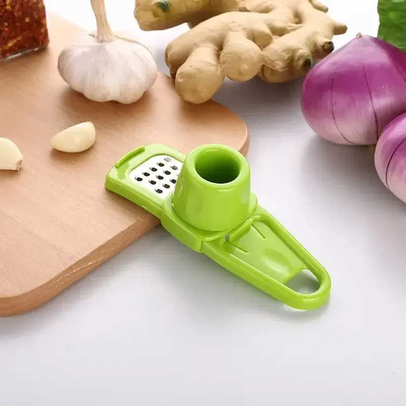 مفرمة ثوم صغيرة يدوية مبتكرة ل - مراجعة Kitchen Gadgets Garlic وسعره